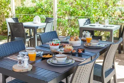 a black table with food and drinks on it at Atalaia Sol Aparthotel - tennis & heated pool in winter in Lagos