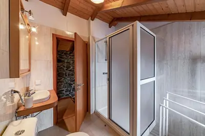 a bathroom with a shower and a sink at Refúgio da Serra - By WeHost in Arco da Calheta