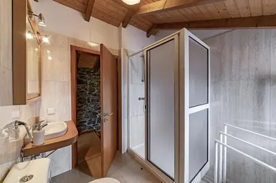 a bathroom with a shower and a sink at Refúgio da Serra - By WeHost in Arco da Calheta