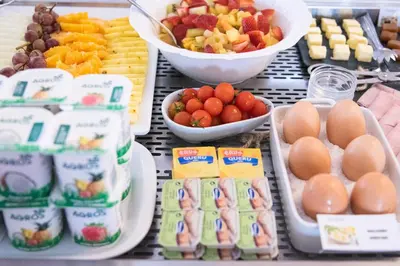 a buffet of food with eggs and fruit and other foods at Hotel Vale Da Telha in Aljezur