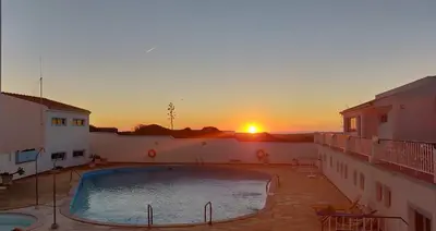 a large swimming pool in the middle of a building at Aparthotel Navigator in Sagres