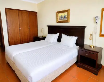 a kitchen with a wooden counter top with a microwave at Aparthotel Navigator in Sagres