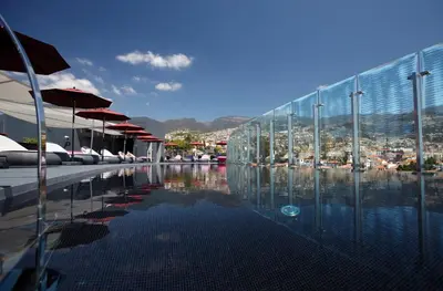 a swimming pool with a view of a city at The Vine Hotel in Funchal