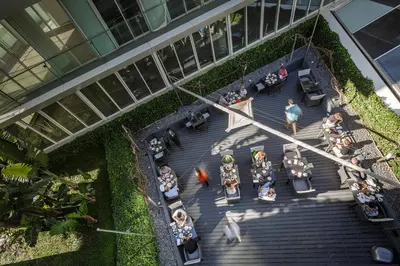 an overhead view of a group of people sitting on stairs at The Vine Hotel in Funchal