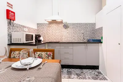 a kitchen with a table with a plate on it at Casa da Ribeira in Funchal