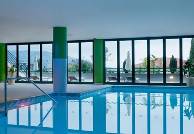 a swimming pool with a view of the city at Madeira Panorâmico Hotel in Funchal