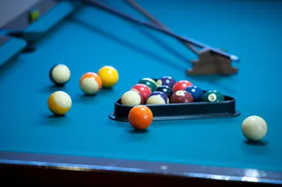 a group of balls on a pool table at Madeira Panorâmico Hotel in Funchal