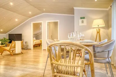 a dining room with a table and chairs at Casa da Praia, a Home in Madeira in Tábua