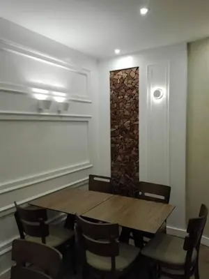a dining room with a wooden table and chairs at Hotel Do Centro in Funchal