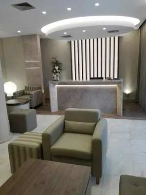 a lobby with a waiting room with a couch and a table at Hotel Do Centro in Funchal