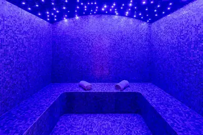 a purple room with a tub with purple lights at Belavista Da Luz - Wellness & Lifestyle Hotel in Luz
