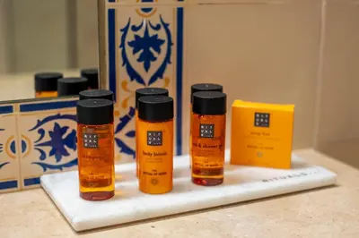 three bottles of essential oils sitting on a counter at Belavista Da Luz - Wellness & Lifestyle Hotel in Luz