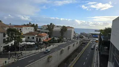 a view of a city street with cars on the road at Flat view Mercado in Funchal