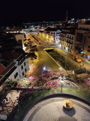 a view of a city street at night at Flat view Mercado in Funchal