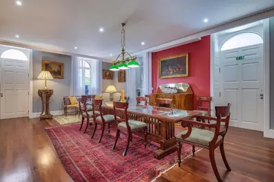 a dining room with a table and chairs at Century House with private pool by Holiday Rental Madeira in Funchal
