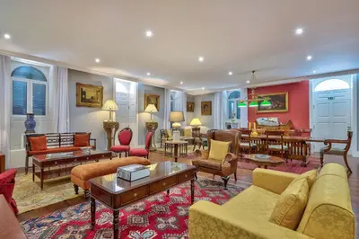 a living room with couches and chairs and tables at Century House with private pool by Holiday Rental Madeira in Funchal