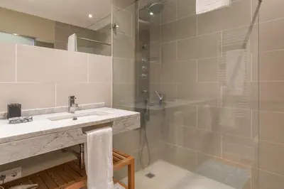 a bathroom with a sink and a shower at The Docks in Paul do Mar