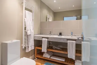 a bathroom with a sink and a toilet at The Docks in Paul do Mar