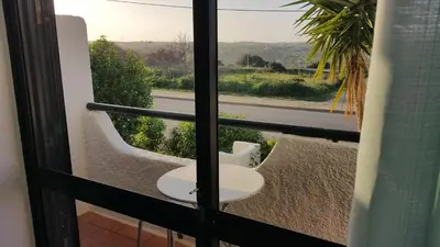 a bathroom with a sink and a view of a street at Sunset Relax Porch in Lagos