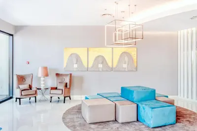 a living room with a couch and chairs at Vila Baleira Funchal in Funchal