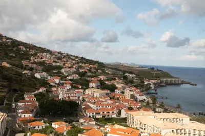 a town on a hill next to the ocean at ZiZis Place in Santa Cruz