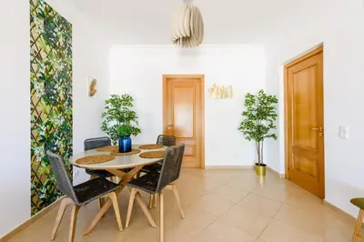 a dining room with a table and chairs at Boavista in Quatro Estradas