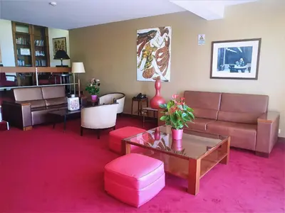 a living room with a couch and a table at Hotel Catedral in Funchal