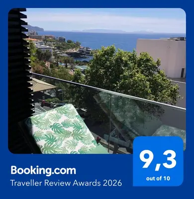 a view of the ocean from the balcony of a building at Astro Vista Madeira Apartments in Funchal