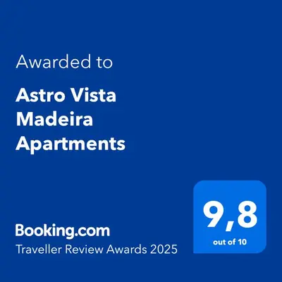 a tall building with glass balconies on it at Astro Vista Madeira Apartments in Funchal