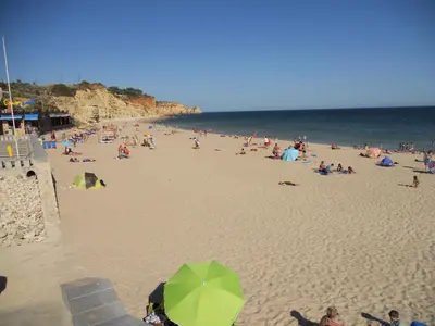 a large group of people on a beach at Vivenda Solmar in Lagos