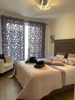 a bedroom with a bed with two towels on it at Madeira Mar - Seaview in Funchal