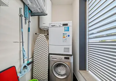 a washing machine in a small room in a train at Madeira Mar - 