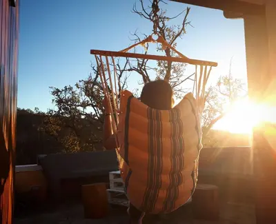 a person in a life vest shooting at a basketball hoop at Casa Benedita in Ponta do Pargo