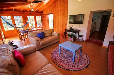 a living room with a couch and a table at Casa Benedita in Ponta do Pargo