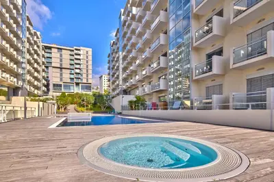 a balcony with a table and a view of the ocean at Blue Sky Apartment with pool by Holiday Rental Madeira in Funchal