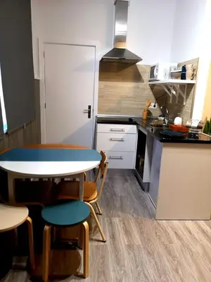 a kitchen with a table and chairs in a kitchen at Apartment Madeira Happiness in Funchal