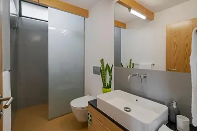 a bathroom with a sink and a toilet and a shower at OurMadeira - Quinta Inácia in Calheta