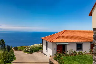 a house with a view of the ocean at OurMadeira - Quinta Inácia in Calheta