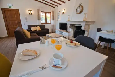 a living room with a table with food on it at Casa da Ladeira Branca in Lagos