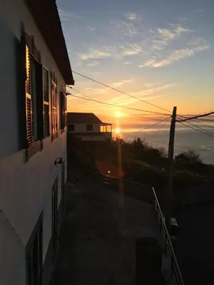 a sunset seen from a balcony of a house at Paradise View in Gaula