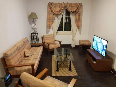 a living room filled with furniture and a flat screen tv at Paradise View in Gaula