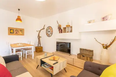 a living room with a couch and a table at FLH Quintinha Rocha in Funchal
