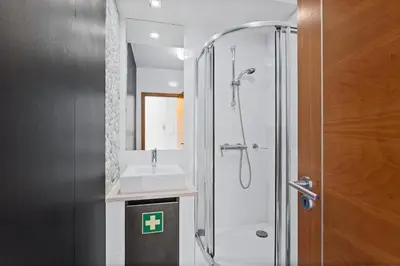 a bathroom with a shower and a sink at Luxury Holiday 2-bedroom Apartment Praia da Luz in Luz