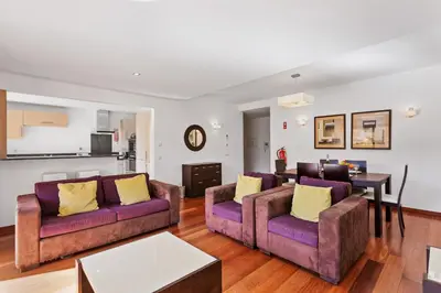 a living room with two couches and a table at Luxury Holiday 2-bedroom Apartment Praia da Luz in Luz