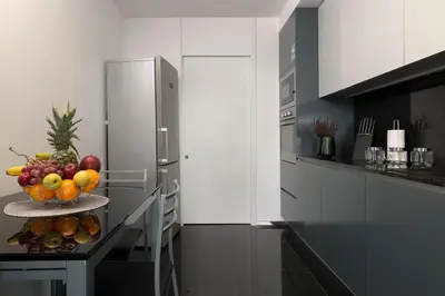 a kitchen with a bowl of fruit on a table at Angel´s Paradise Luxury and Sophistication in Funchal