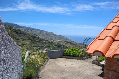a view of the ocean from a house at Casas Tipicas Candelaria Tabua in Ponta do Sol