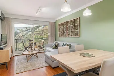 a living room with a couch and a table at Vila Formosa I by An Island Apart in Funchal