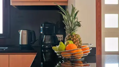 a bowl of fruit on a counter in a kitchen at Capela's House by LovelyStay in Ribeira Brava