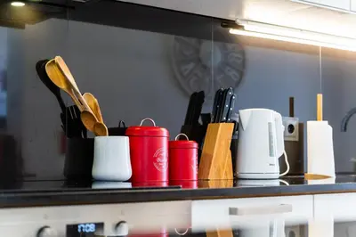 a counter top with a bunch of utensils on it at Sunny Getaway in Funchal in Funchal