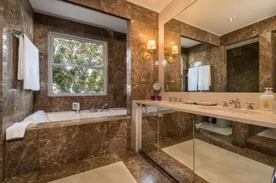 a bathroom with a tub and a sink at CASA DA LEVADA in Funchal